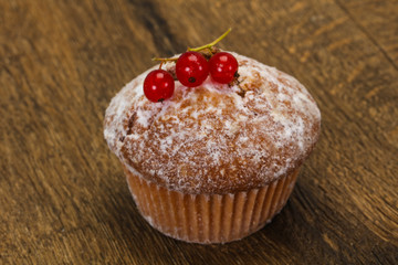 Sweet tasty muffin with red currants