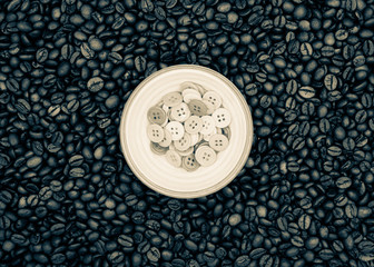 Roasted Coffee Beans with A Bowl of Buttons