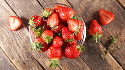 bowl of strawberry on wood background