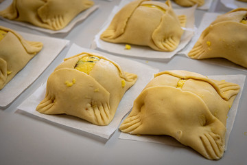Cypriot easter cheese pastries called flaounes ready to be cooked.
