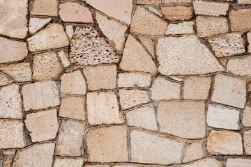 Background of a stone wall with cracks.