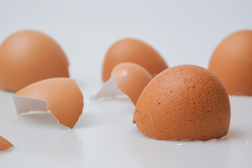 Broken egg shell on white background