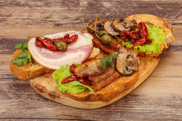 Italian appetizer - bruschetta mix with meat