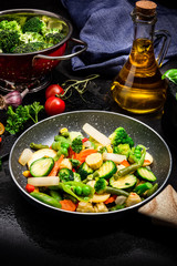 Stir Fry Fresh Vegetables Mix on Frying Pan. Dark Tones Black Image. Healthy Eating Ideas