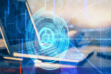 Double exposure of desktop computer and technology theme hologram. Concept of software development.