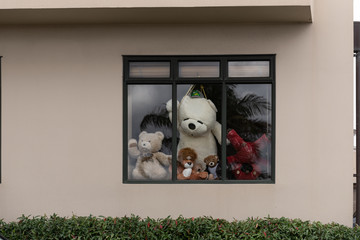 Teddy bears in a window in the "Bear Hunt" designed to distract and amuse children on exercise walks during coronavirus/covid-19 lockdown.