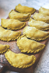 Dumplings of whole wheat with stuffed potato filling. Vegan, vegetarian food.