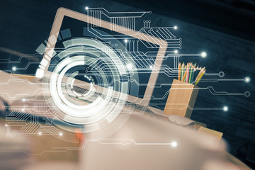 Double exposure of desktop computer and technology theme hologram. Concept of software development.