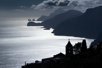 silhouette of Nocelle village (Positano) and Capri island in background seen from the Path of the...