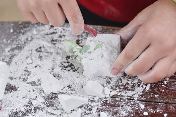 Children having fun with archaeology excavation kit. Boy plays an archaeologist excavated, training for dig fossil