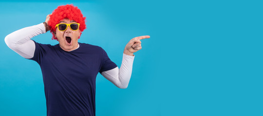 man with funny wig isolated on color background