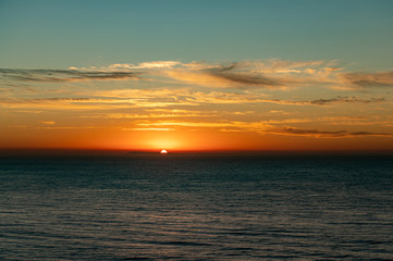 Fototapeta premium Sunrise over the Southern Ocean from Bird Rock Lookout, Torquay, Victoria, Australia