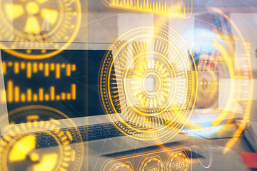 Fototapeta premium Computer on desktop in office with technology theme hologram. Multi exposure. Tech concept.