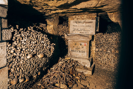 underground catacombs full of bones, gravestones and inscriptions