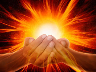 Hands with light and energy rays