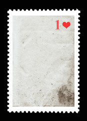 Vintage blank postage stamp and one red heart on a black background. Valentine's Day.