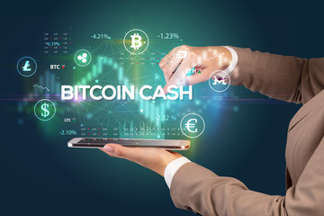 Close-up of a touchscreen with BITCOIN CASH inscription, business opportunity concept