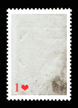 Vintage blank postage stamp and one red heart on a black background. Valentine's Day.