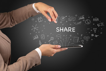 Close-up of a touchscreen with SHARE inscription, social media concept