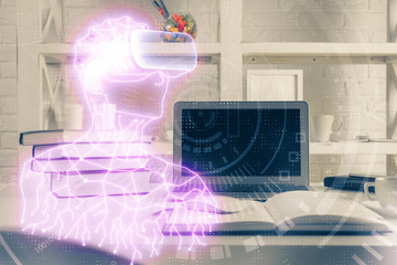 Computer on desktop with AR theme icon. Multi exposure. Concept of augmented reality.