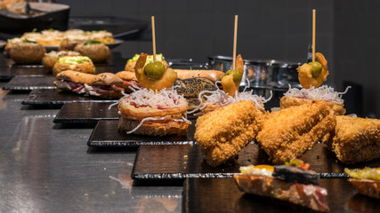 Close-up of pinchos/tapas in a bar of the old town of Vitoria-Gasteiz, Basque Country, Spain