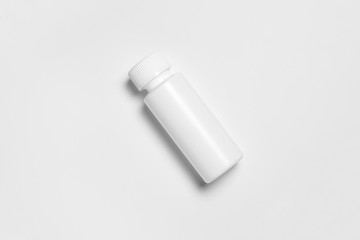 Plastic bottle with a pipette. Mock-up bottle with a medical drug. Pharmacy blank packing. Medical dropper bottle.High-resolution photo.Top view