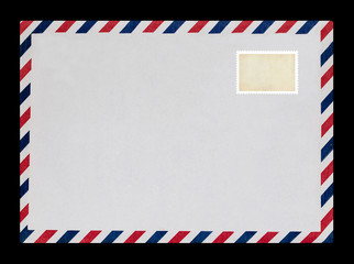 Vintage postage envelope on a black background, message, air mail