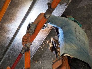 Fototapeta premium Welding work ,worker with protective welding metal on construction