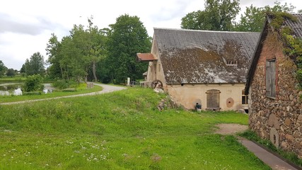Very old agricultural buildings in the Latvian village of Jaunpils in the summer of 2019