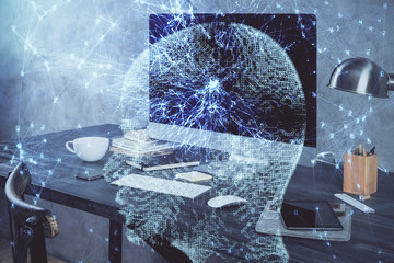 Double exposure of table with computer and brain hologram. Data innovation concept.