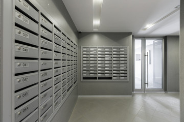 mailboxes in the lobby of an apartment building