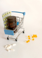 pills in a basket on a white background
