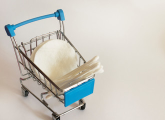 cotton pads and paper cotton buds in a basket

