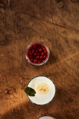 Yogurt on a wooden background. Summer food.