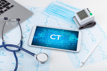 Close-up view of a tablet pc with CT abbreviation, medical concept