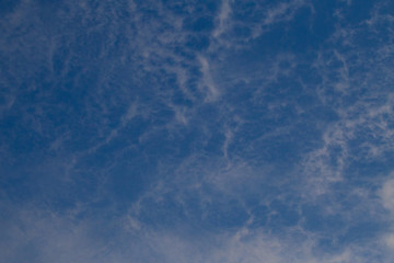 The blue sky has sparse white clouds