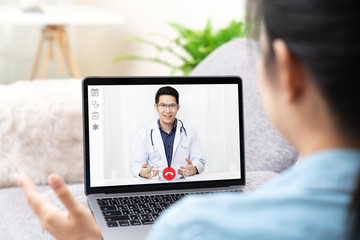 Telemedicine asian doctor video conference call online talking for follow up remotely with medical coronavirus result at home.Online healthcare digital technology service, counselor and interview app.