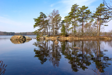 View of a small island, situated in a lake, typical for the south of Sweden