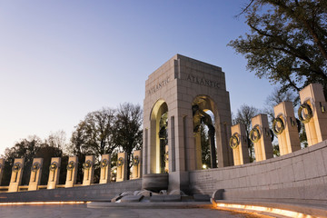 Night photograph from the National World War Two Memorial plaza including the Atlantic Pavilion & vertical granite pillars on the north-side of the war memorial, National Mall, Washington DC