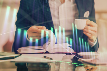 Double exposure of businessman with coffee with stock market forex chart.
