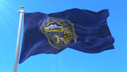 Flag of american state of Nebraska, region of the United States, waving at wind