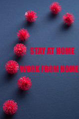 Coronavirus plastic models with inscription Stay at home Work from home. Sars-cov-2 pandemic concept COVID-19 pandemic concept 