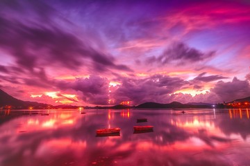 Beautiful pink sky with its reflection in the lake
