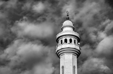 Minaret of a Mosque in Bahrain with clouds in the background