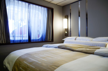 Detail or close up view of bed and window inside outside or exterior or oceanview stateroom or...