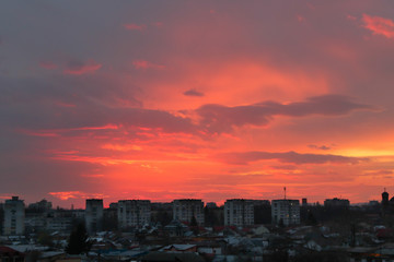Fototapeta premium Beautiful sunset above the city skyline , The city of Ploiesti, Romania with a beautiful sun