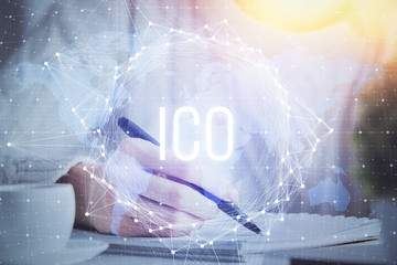 Cryptocurrency hologram over hands taking notes background. Concept of blockchain. Multi exposure