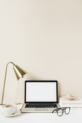 Blank screen laptop. Home office desk table workspace. Copy space mockup template.