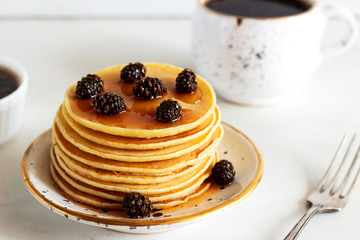 stack of sweet  pancakes  with fir cone jam and coffee on white background.