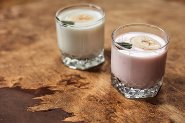 Yogurt on a wooden background. Summer food.